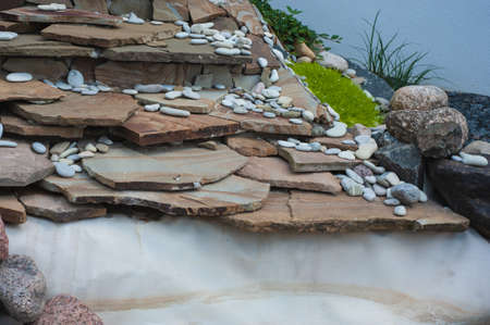 Pebbles, small white stones, the texture of the stone. flower bed designの写真素材
