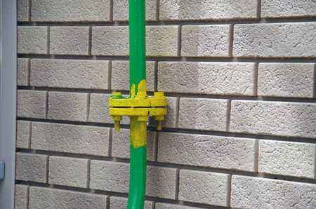Valve on an old gas pipe in a residential area of a European city. Worn out gas communicationsの写真素材