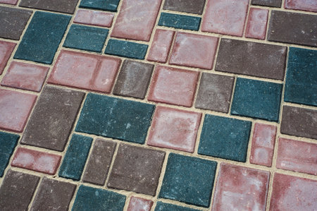 Paving slabs of different colors and shapes.Texture of different colored patterned paving slabs .の写真素材