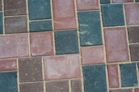 Paving slabs of different colors and shapes.Texture of different colored patterned paving slabs .の写真素材