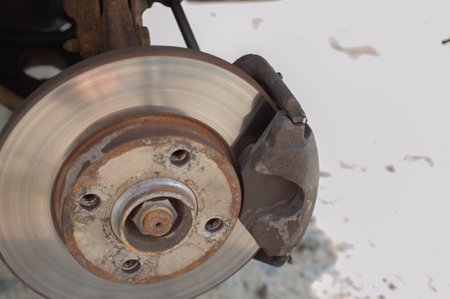 Close up Rear brake caliper and disk with jack kit of car service tool for check brake pads and brake disc thickness, Initial inspection by yourself of car service concept.の写真素材