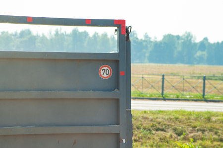 Truck trailer with blue container. trailer inside hangar. Metal container for equipment transportation. Transportation equipment on truck. Truck trailer sale concept.の写真素材
