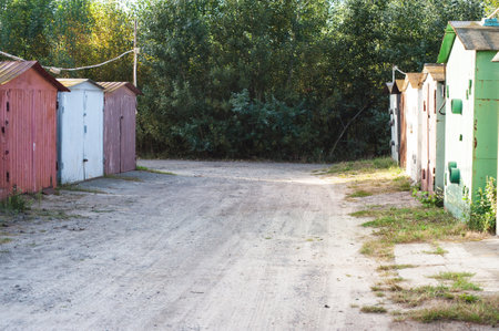 Old rusty multi-colored garages with bad roads. garage cooperative.の写真素材