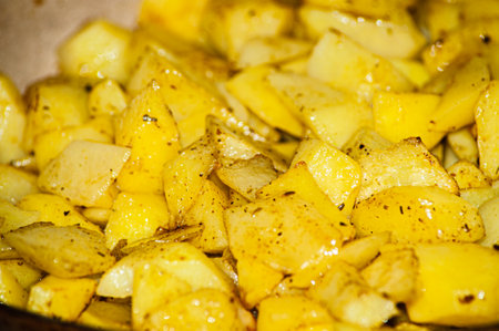 baked potatoes. golden texture. Potatoes in the oven.の写真素材