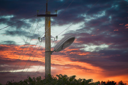 Electric lines overhead, power lines against bles sky.の写真素材