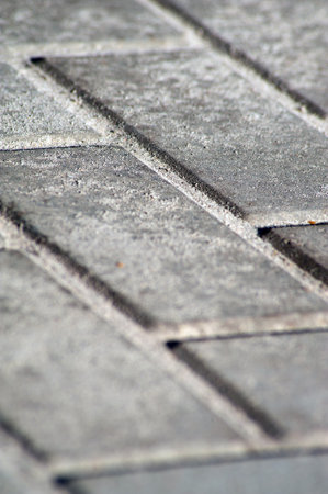 Gray paving stone background on city street.の写真素材