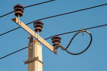 Power electric pole with line wire on colored background close up, photography consisting of power electric pole with line wire under sky,の写真素材