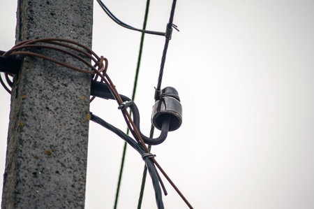 Power electric pole with line wire on colored background close up, photography consisting of power electric pole with line wire under sky,の写真素材