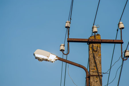 Power electric pole with line wire on colored background close up, photography consisting of power...