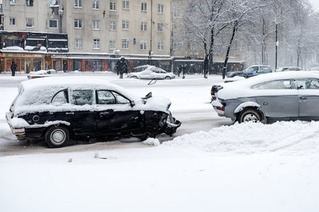 Crashed cars right after an accident on winter road with snow.の素材