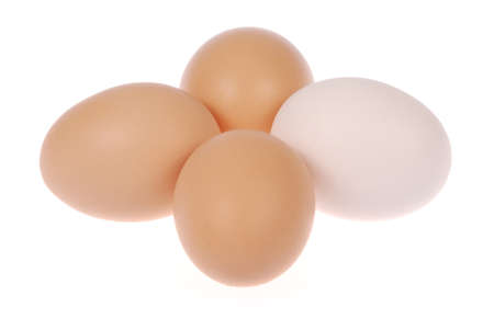 Four eggs. One egg white. Isolated on a white background. の写真素材