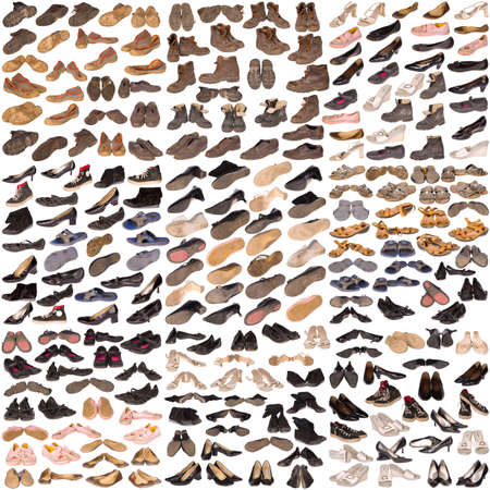 Many old, well-used running shoes and boots, all logos and brand markings removed, isolated on white.の写真素材