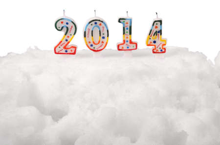 Snow White cake with candles. 2014. On white background. の写真素材