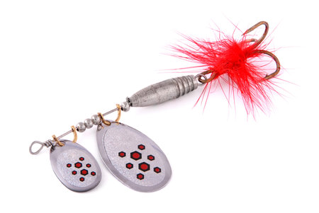 silver fishing spoon with two lobes isolated on whiteの写真素材