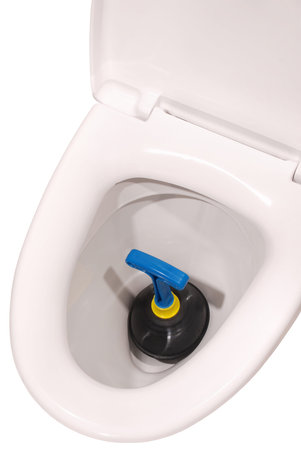 White toilet bowl and plunger on white. Clipping path included.の写真素材