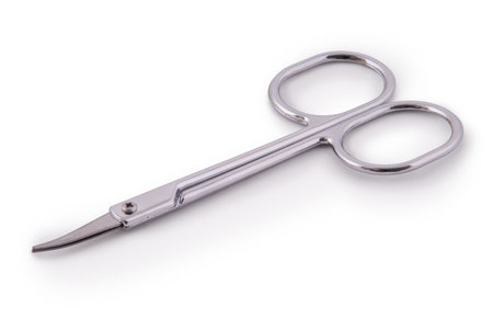 Small steel manicure scissors isolated on white with clipping pathの写真素材