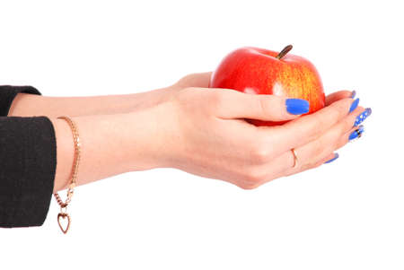 Girl holding a red apple isolated on whiteの写真素材