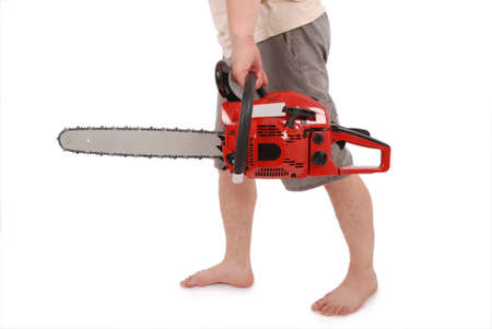 By one hand holding a chainsaw isolated on whiteの写真素材