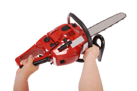 Showing how to work with chainsaw isolated on whiteの写真素材