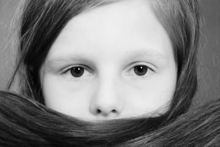 Portrait girls covers her face with hair. Black and white vintage effectの写真素材