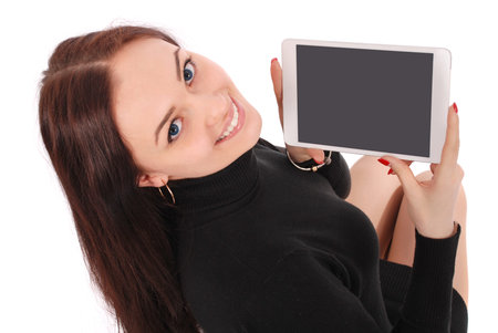 Happy student teenage girl with tablet pc. Sitting sideways isolated on white