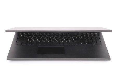 Black laptop white background with soft shadow.