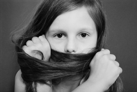 Portrait girls covers her face with hair. Black and white vintage effectの写真素材