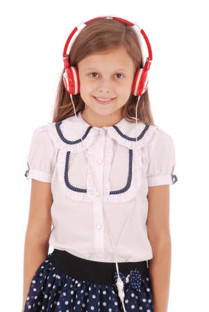 Happy young girl listening to music, isolated on whiteの写真素材