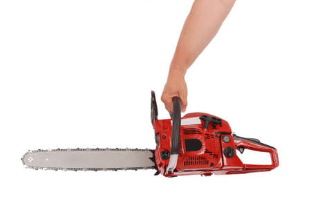 By one hand holding a chainsaw isolated on whiteの写真素材