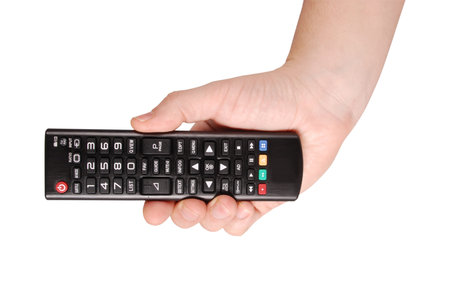 Hand holding remote control to the TV isolated with path