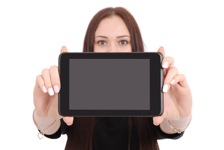 Smiling student teenage girl showing a tablet display application isolated on white. Focus on tablet...