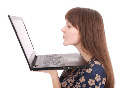 Portrait of student teenage girl with laptop isolated on whiteの写真素材