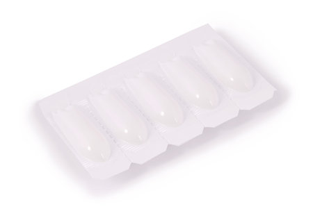 Pack of medical suppositories isolated on white background.