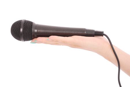 Hand with microphone isolated on white backgroundの写真素材