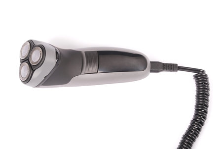 New black electric razor close up isolated on white background