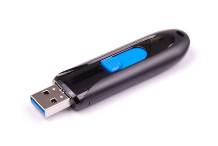 Black and blue USB flash drive isolated on white background with soft shadow