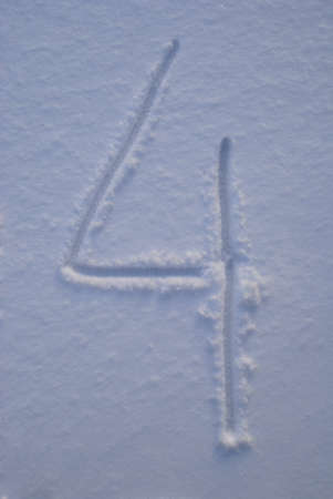 Winter numbers handwritten on snow backgroundの写真素材