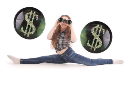Happy young girl with binoculars and dollars sign isolated on whiteの写真素材