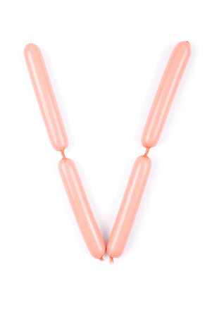 Alphabet letter V arranged from sausage isolated on the whiteの写真素材