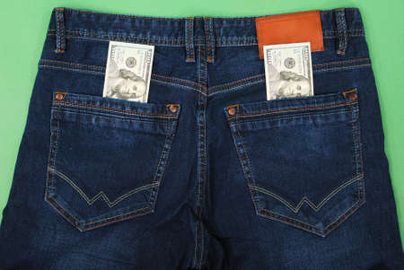 Cash, money is in the pocket of blue jeans. Close upの写真素材