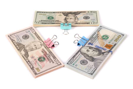 Three wads of money one hundred fifty and twenty dollars isolated on white backgroundの写真素材