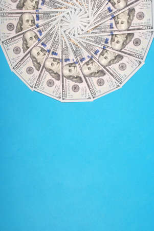 Mandala kaleidoscope from money. Abstract money background raster pattern repeat mandala circle. On blue background.の写真素材