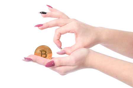 Hands holds and shows the heart golden cryptocurrency bitcoin in hands on white backgroundの写真素材