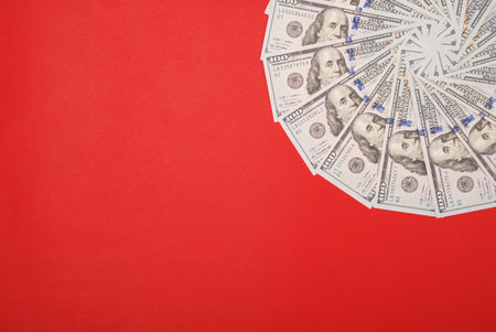 Mandala kaleidoscope from money. Abstract money background raster pattern repeat mandala circle. On red background.の写真素材