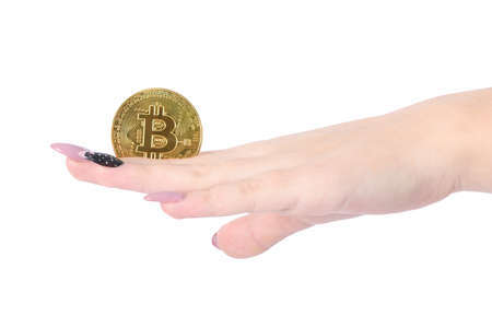 Hands holds and shows the heart golden cryptocurrency bitcoin in hands on white backgroundの写真素材