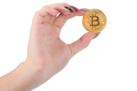 Hands holds and shows the heart golden cryptocurrency bitcoin in hands on white backgroundの写真素材