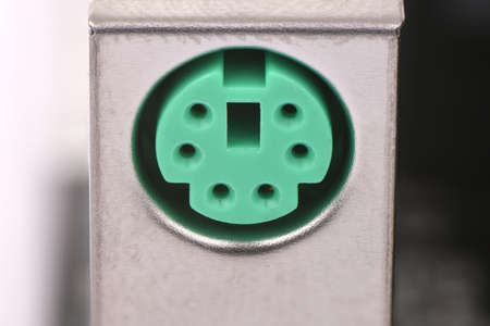 Closeup of a green connector for connecting a PC mouse to a computer.の写真素材