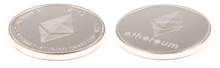 Golden ethereum isolated on white background. Front and back sides are shown. High resolution photo....