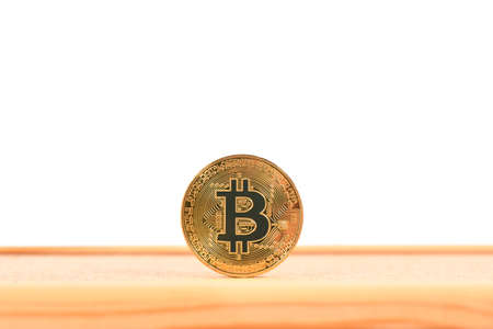 Golden bitcoin on brown textured cork. High resolution photo. Full depth of field.の写真素材