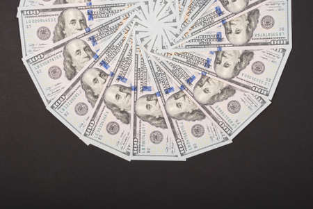 Mandala kaleidoscope from money. Abstract money background raster pattern repeat mandala circle. On black background.の写真素材